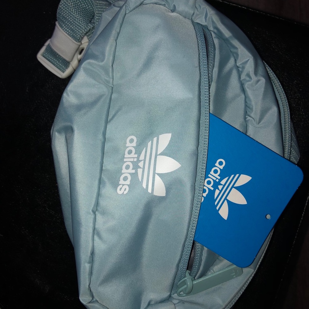 New Lt blue Adidas fanny pack with lifetime warr